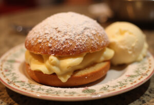 Delicious Kirschmichel dessert garnished with powdered sugar and vanilla ice cream, perfect for dessert lovers.